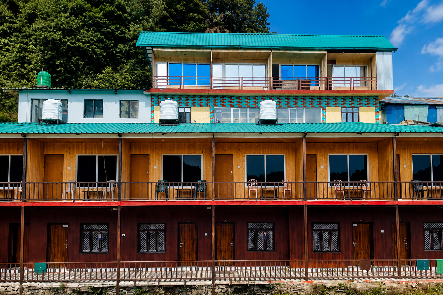 Hotel Deepajay Chopta exterior with mountain backdrop